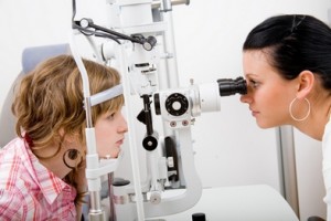 Beautiful young doctor inspect a patient in ophthalmology labor